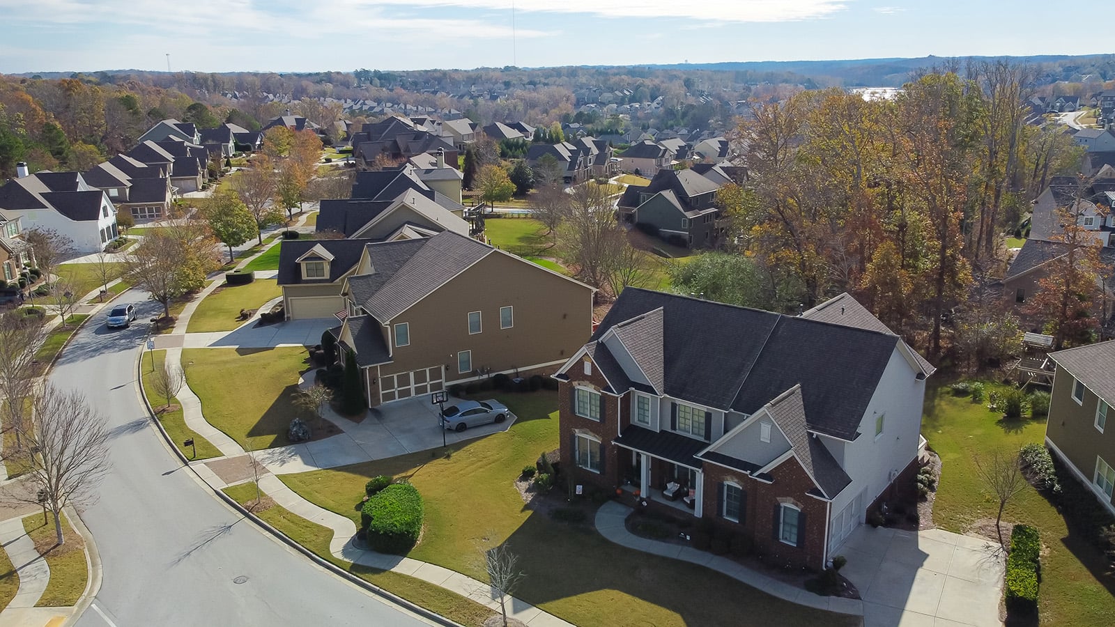 Aerial,View,Suburban,Residential,Street,With,Row,Of,Upscale,Two-story