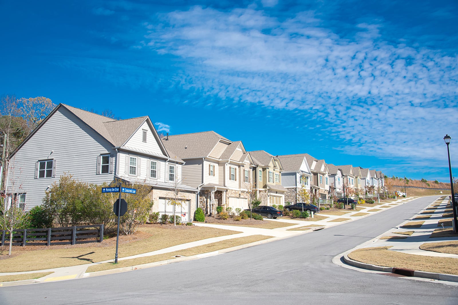 Row,Of,New,Development,Two,Story,Houses,With,Front,Garage