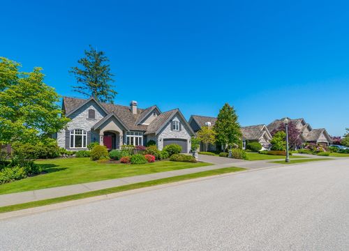 Nice and comfortable neighborhood. Some homes on the empty street in the suburbs of Vancouver, Canada.