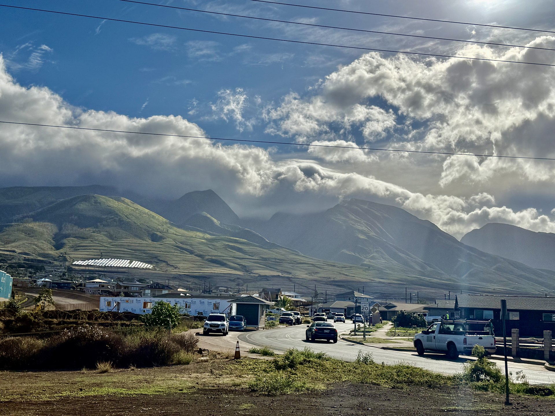 New home framing under construction in Lahaina with the West Maui Mountains behind, October 2025.