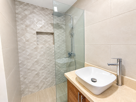 Bright Modern Bathroom with Geometric Shower Tiles