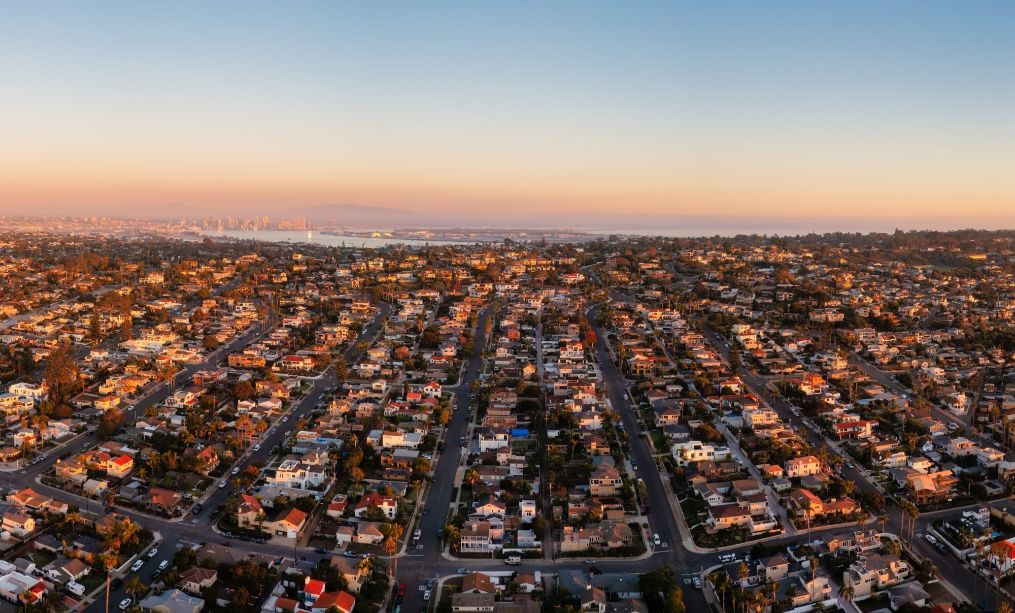 Homes in Point Loma near Sunset Cliffs. San Diego skyline in the distance. Drone photo. (1)