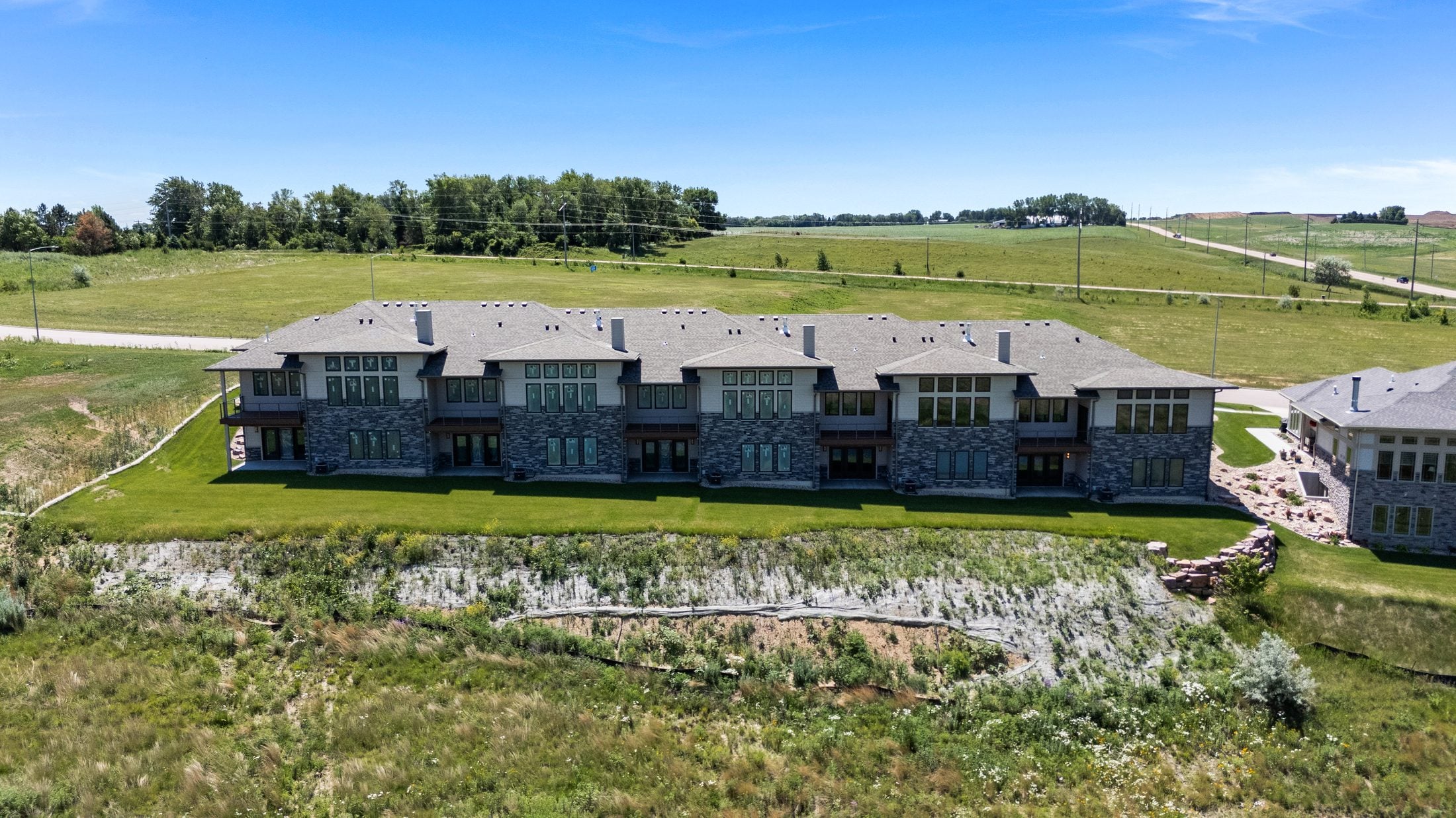 Ponderosa Highlands aerial view of townhome buildings and surrounding land