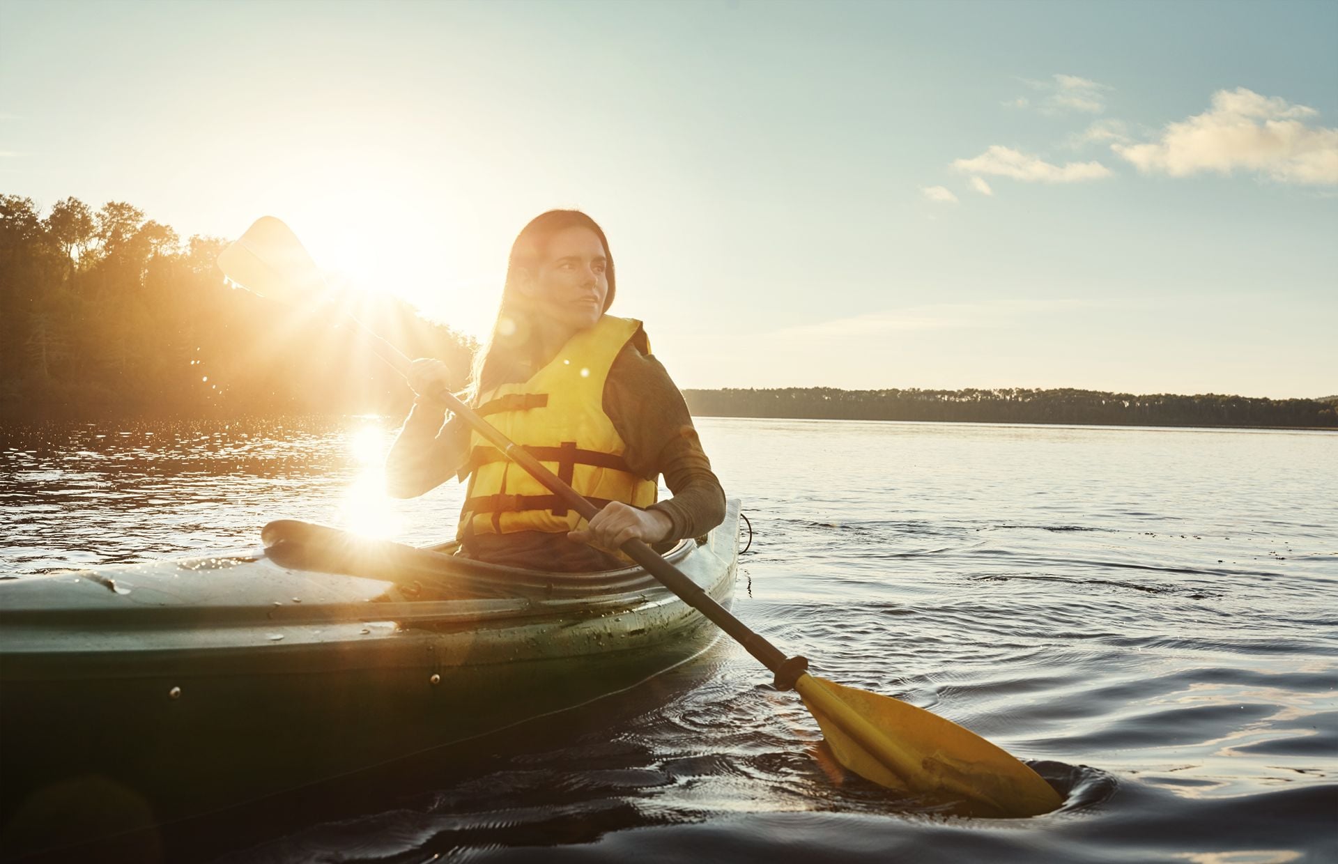 Girl, thinking and outdoor on lake or kayak or water sports, rowing and river journey on summer vacation. Woman, canoeing and travel on holiday in nature with sunshine, adventure and paddle for tour.