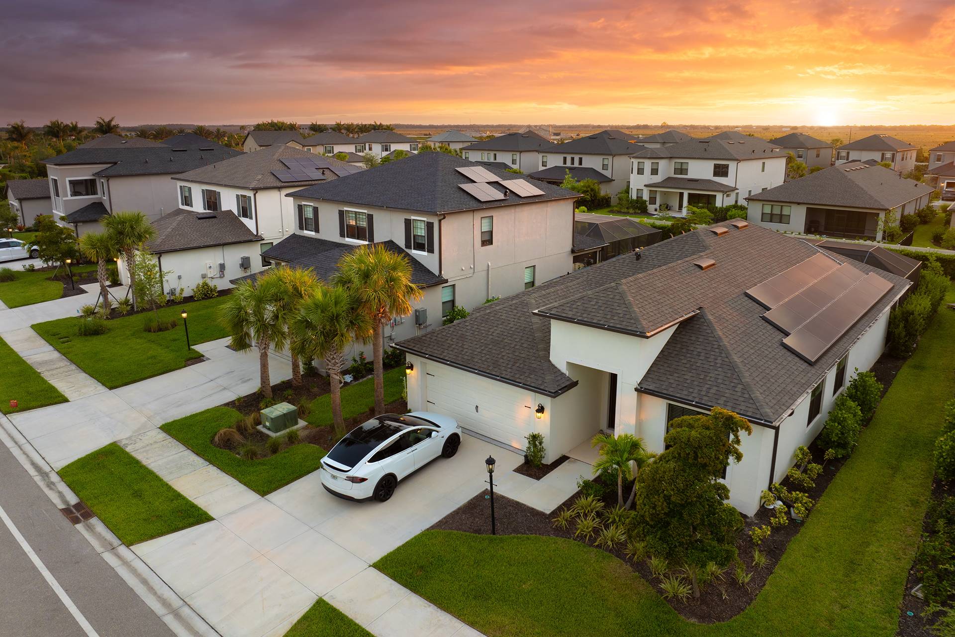 Neighborhood homes at sunset, illustrative photo