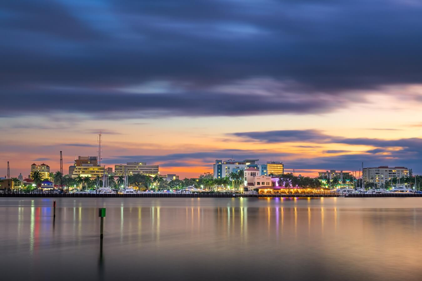 Bradenton, Florida, USA downtown cityscape on the Manatee River at dusk