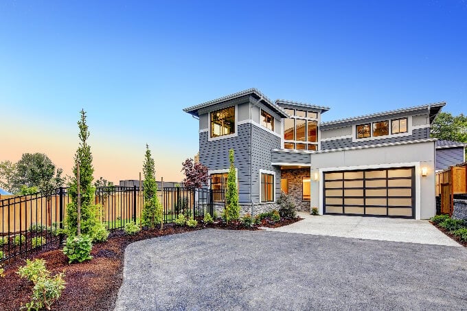 Excellent-curb-appeal-of-a-Modern-craftsman-style-home-accented-by-landscaping-gray-siding-large-windows-small