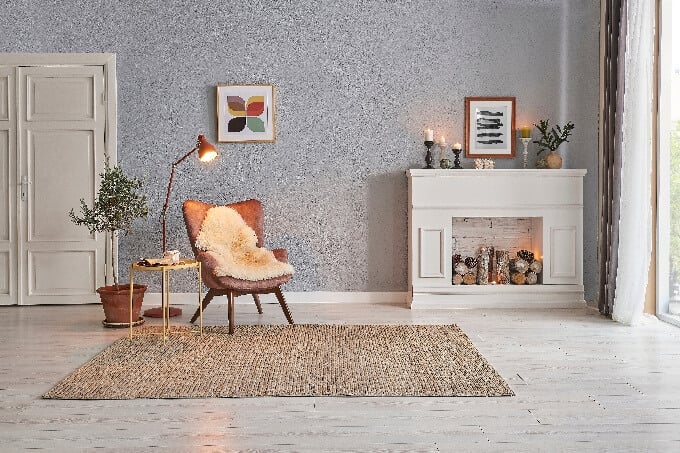 Modern-room-concept-interior-style-chair-fireplace-frame-wicker-carpet-decoration-grey-stone-wall-background-small