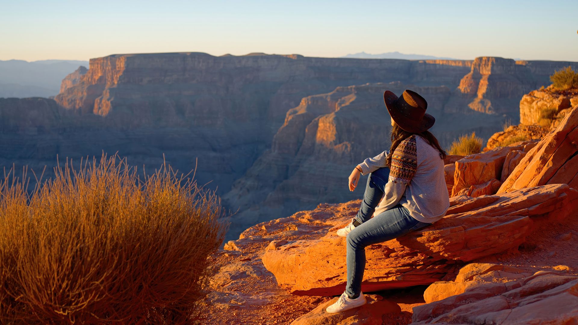 Native American girl is fascinated by the breathtaking beauty of the Grand Canyon - travel photography