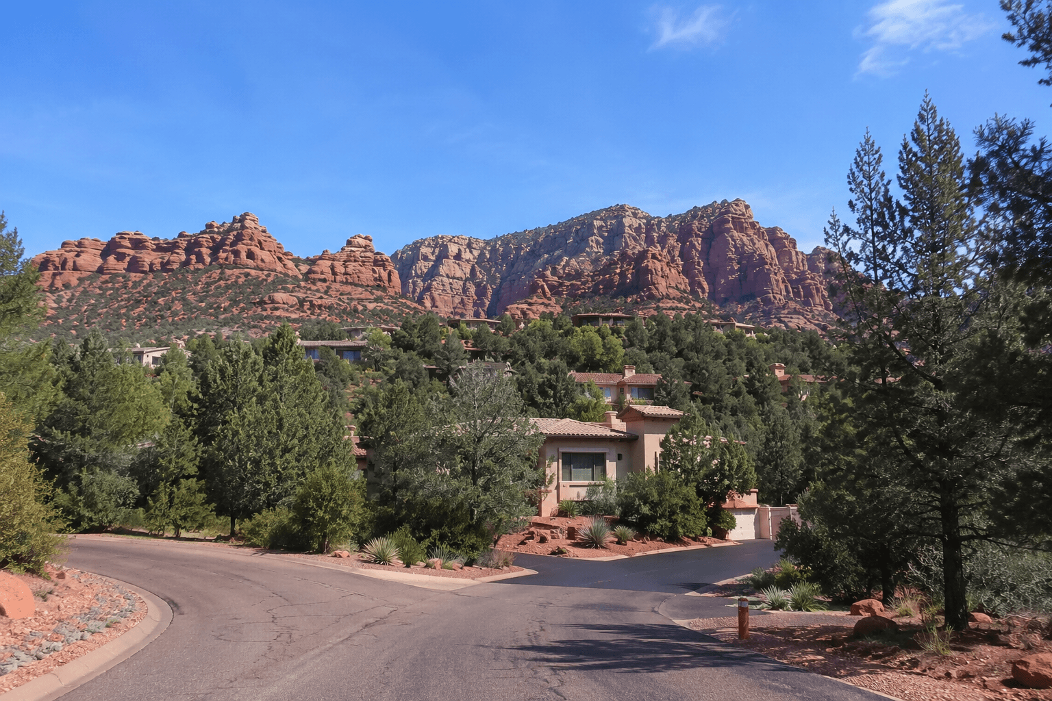 Sunny desert suburb beneath rocky cliffs, the ridge, VOC, Arizona