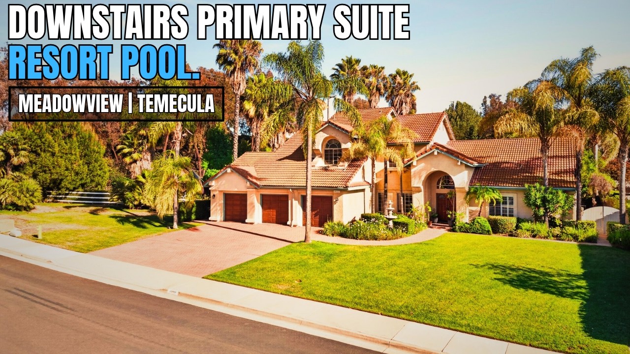 Two-story Meadowview pool home in Temecula, CA with a paver driveway, palm trees and a three-car garage