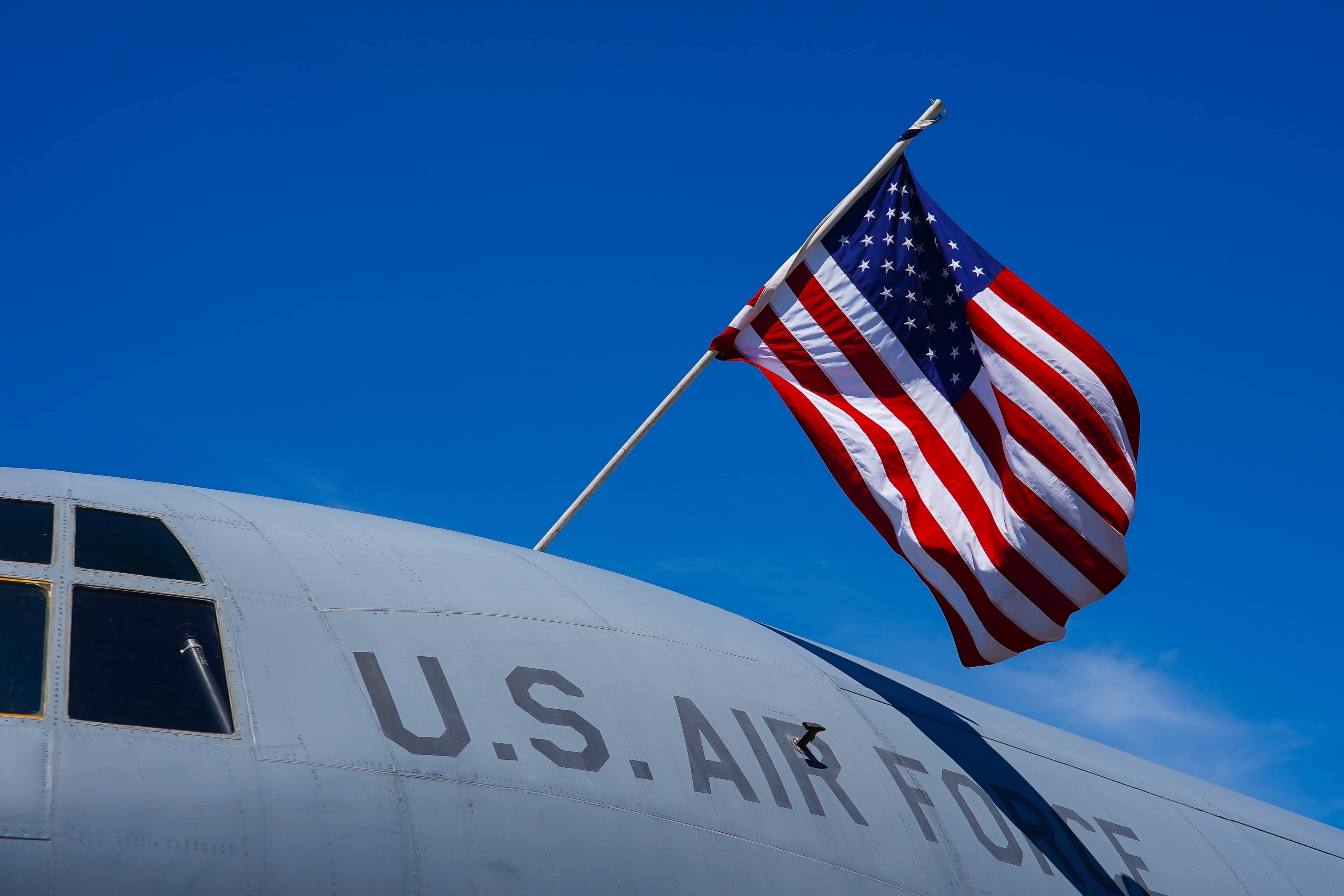 The,Flag,Of,America,Is,Hanging,Over,A,Military,Airplane