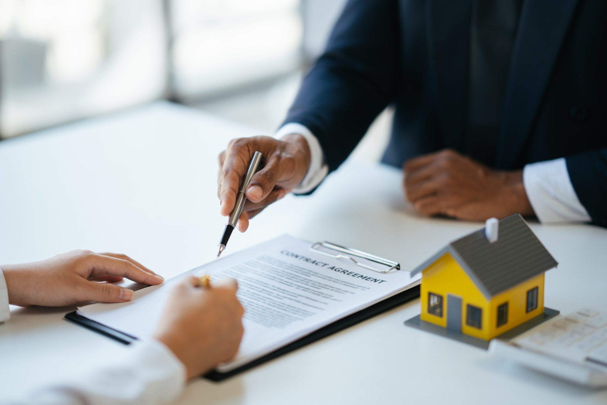 Professional real estate agent guiding and explaining the document process to the customer before the deal was done. (1)