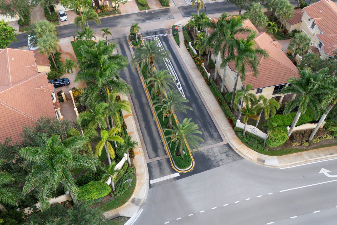 gated-community-entrance-with-palm-trees