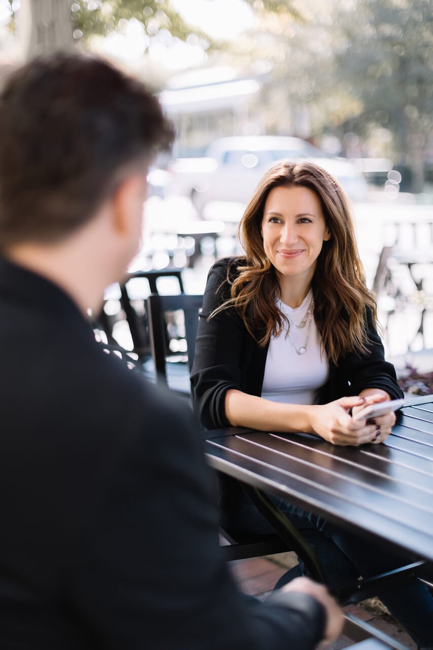 woman-and-person-at-table
