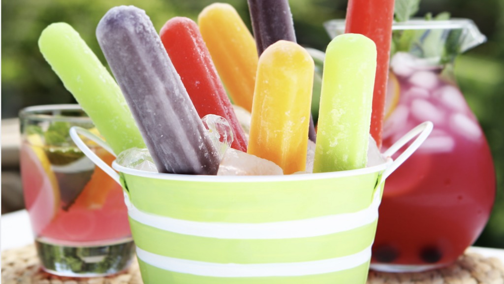 running toward the water with popsicles