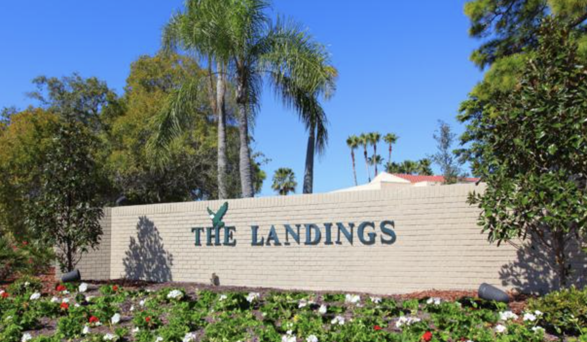 the neighborhood entrance sign for The Landings in Sarasota, FL