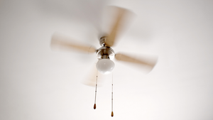 A Sarasota home's ceiling fan rotating to circulate air