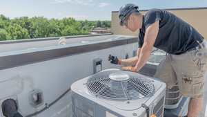  Professional HVAC technician from Sarasota, Florida servicing an air conditioning unit]