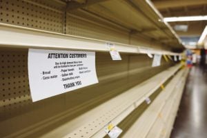 bare shelves in a store - supply chain crisis