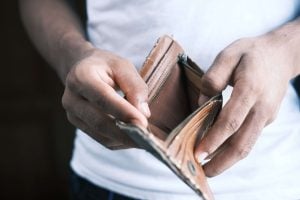close-up of person holding open an empty wallet