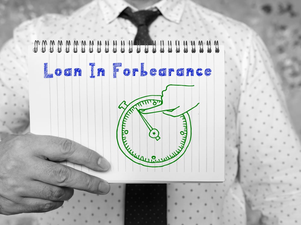 "Loan in Forbearance" sign with picture of a clock