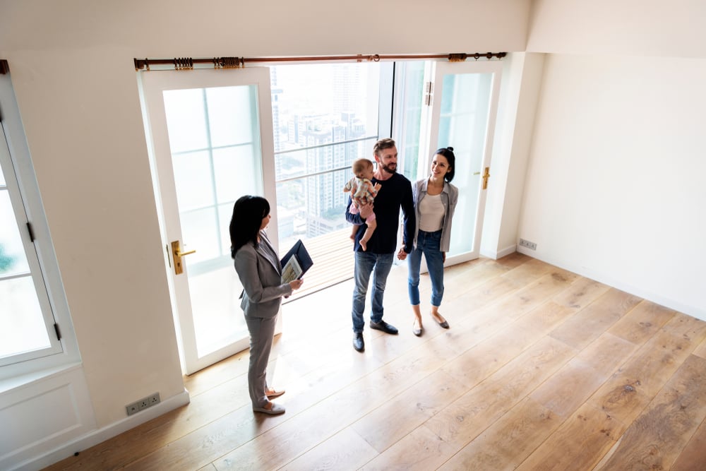 Family tours a house for sale