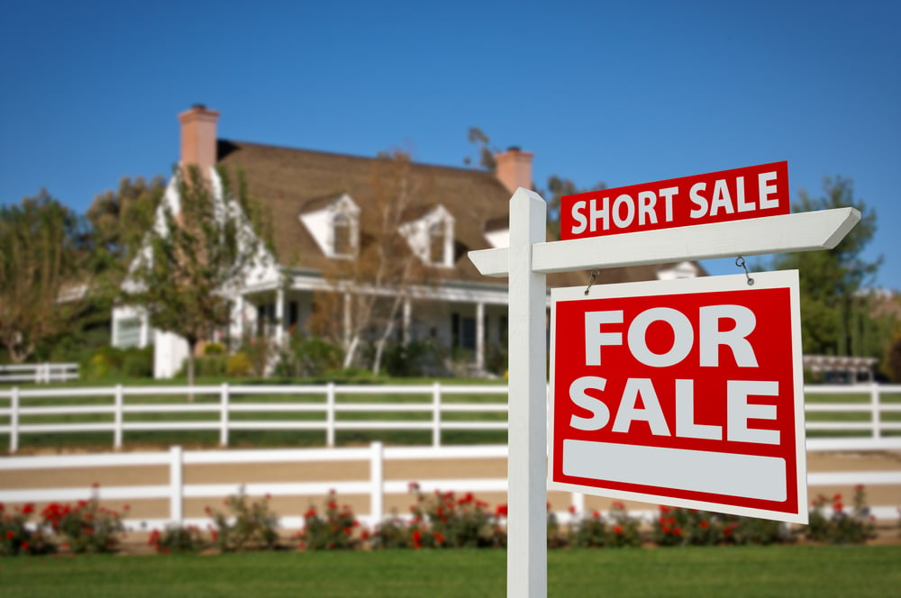 Short Sale sign outside of a nice looking home