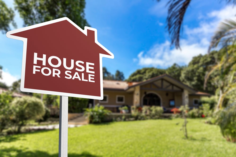 House For Sale sign on front lawn