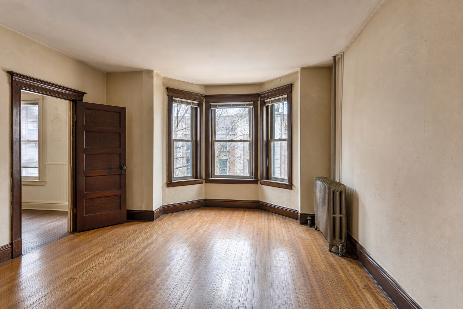 Clean, dated Washington DC rowhouse living room in present condition