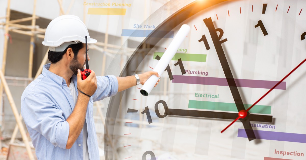 A man in a white hard hat holding rolled blueprints and points while a large clock overlays a building site.