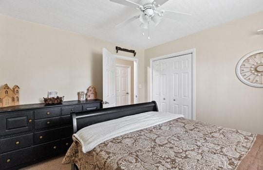 bed, bedroom, closet, ceiling fan