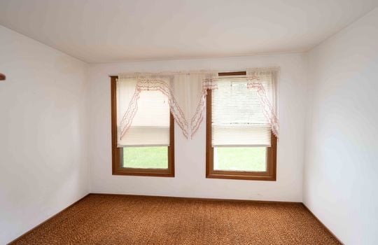 bedroom, carpet, paneling, drywall