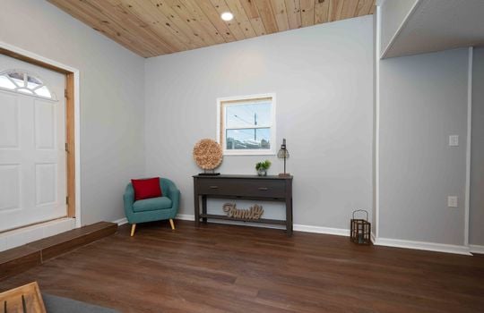 living room, front door, vinyl flooring