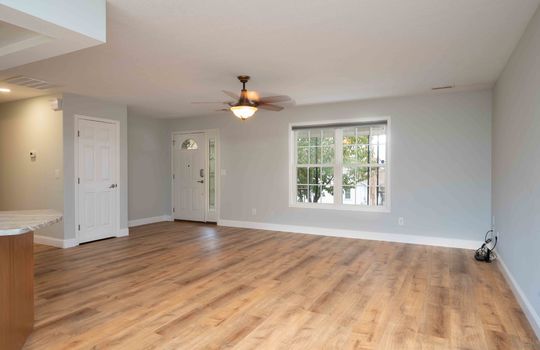 Living Room, Vinyl Flooring, Ceiling Fan, Double Window, Closet, Kitchen Island