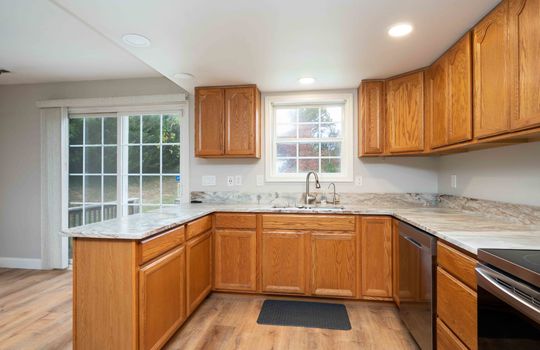 Kitchen Cabinets, Kitchen Sink, Countertops, Dishwasher, Stove, Double Doors