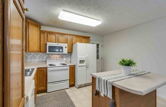 Kitchen, Kitchen Island, Countertops, Cabinets, Refrigerator, Stove, Microwave