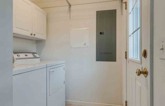 Laundry Room, Electrical Panel, Vinyl Flooring, Cabinets