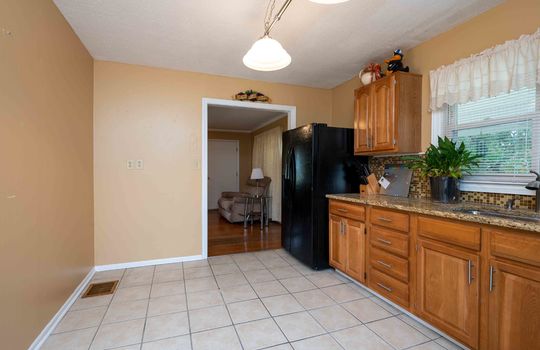 Kitchen, Cabinets, Sink, Window, Countertops, Refrigerator, Tile Flooring