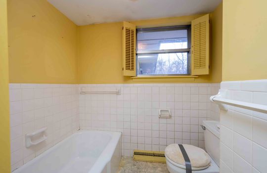 Window, Tile Wall, Tub, Toilet, Towel Rack