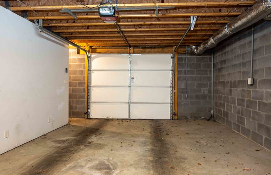 Garage Door, Concrete Flooring, Cinder Block Walls