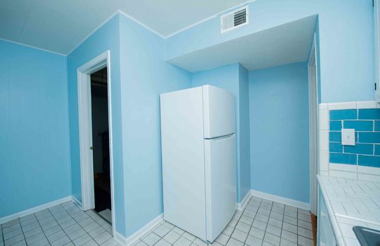 Refrigerator, Tile Flooring, Doorway, Countertops, Tile Backsplash