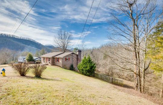 brick ranch, one story, yard, trees, mountains