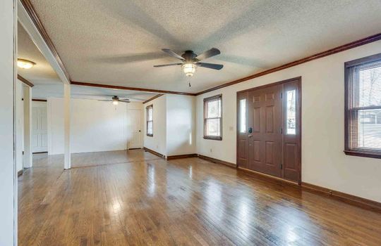 living room, front entrance, ceiling fans, hardwood flooring