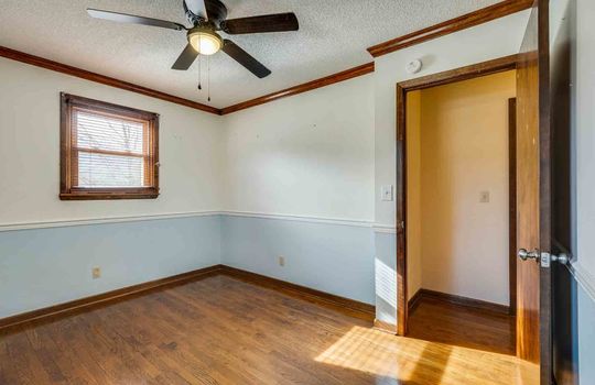 bedroom, hardwood flooring, ceiling fan, window, door