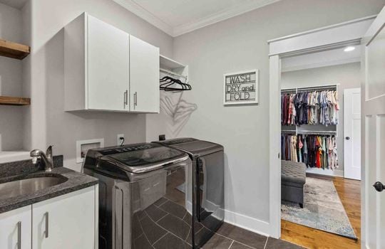 laundry room, cabinet, tile flooring