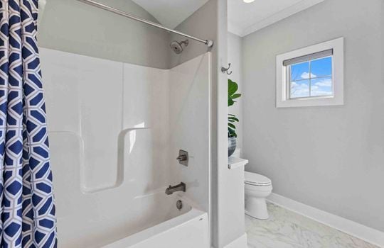 Shower, tub, toilet, tile flooring