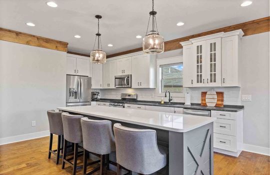 Kitchen, cabinets, stainless appliances, white cabinetry, kitchen island
