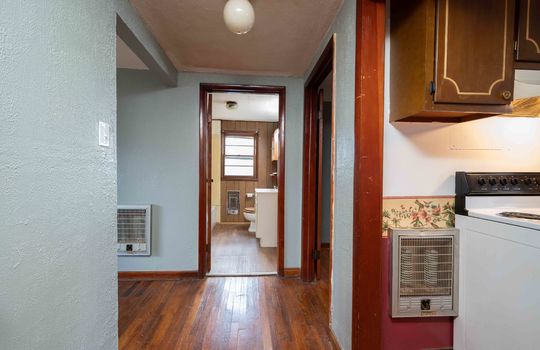 hallway, kitchen, living room, hardwood flooring