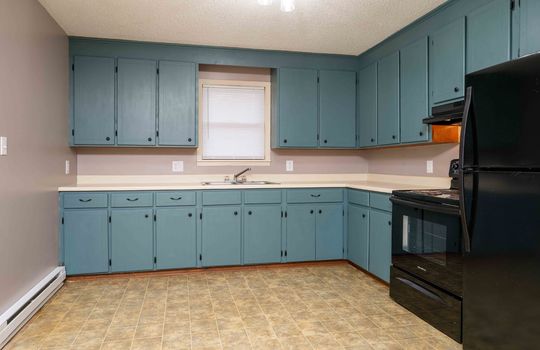 114 Monterey, Kitchen, Cabinets, Sink, Counters, Window, oven, refrigerator, vinyl flooring